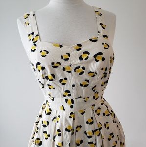 Cooperative white dress with cheetah pattern